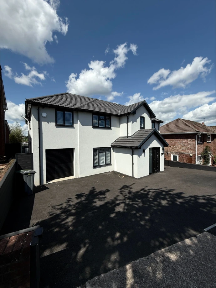 Single storey house extension with paved garden area built in Cardiff